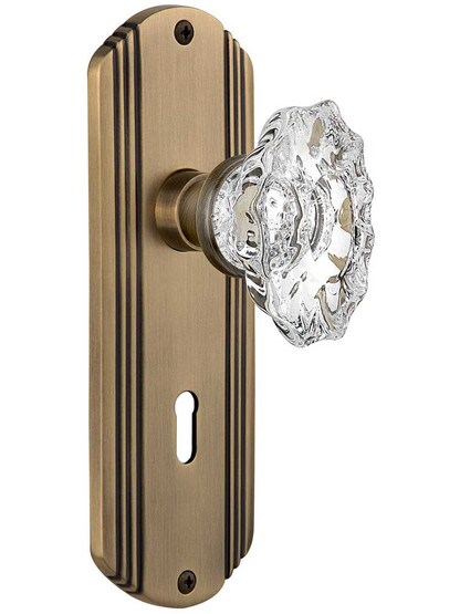Streamline Deco Door Set with Keyhole and Chateau Crystal Glass Knobs in Antique Brass.